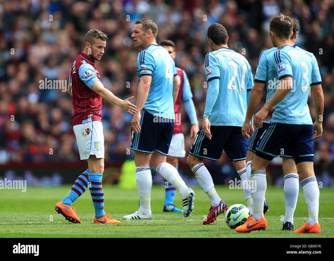 West Ham United's Morgan Amalfitano (21) refuses to shake hands with Aston Villa's Tom Cleverley during the Barclays Premier League match at Villa Park, Birmingham. Stock Photo