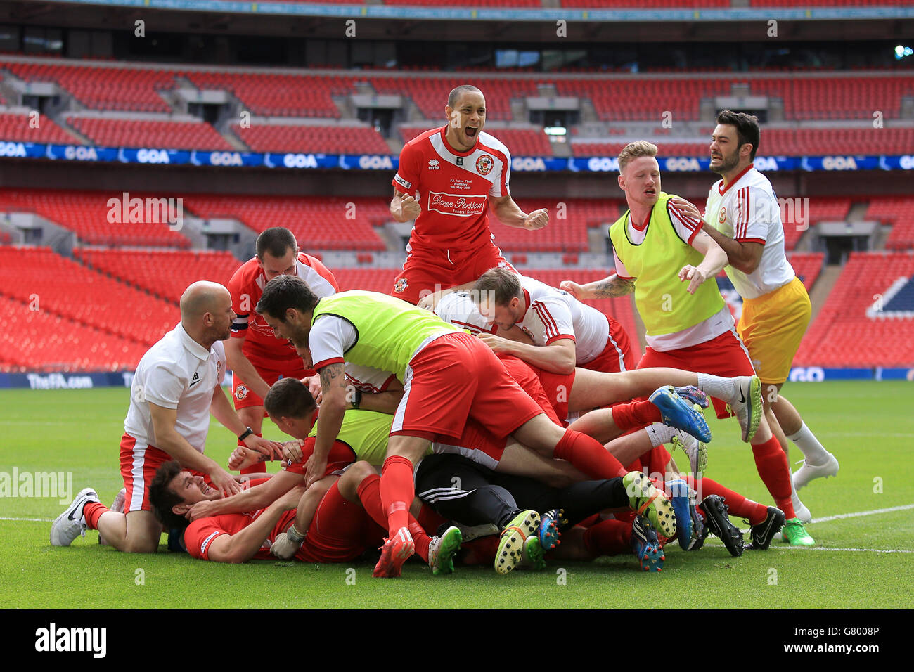 North Shields' Adam Forster (obscured) is mobbed by teammates as he