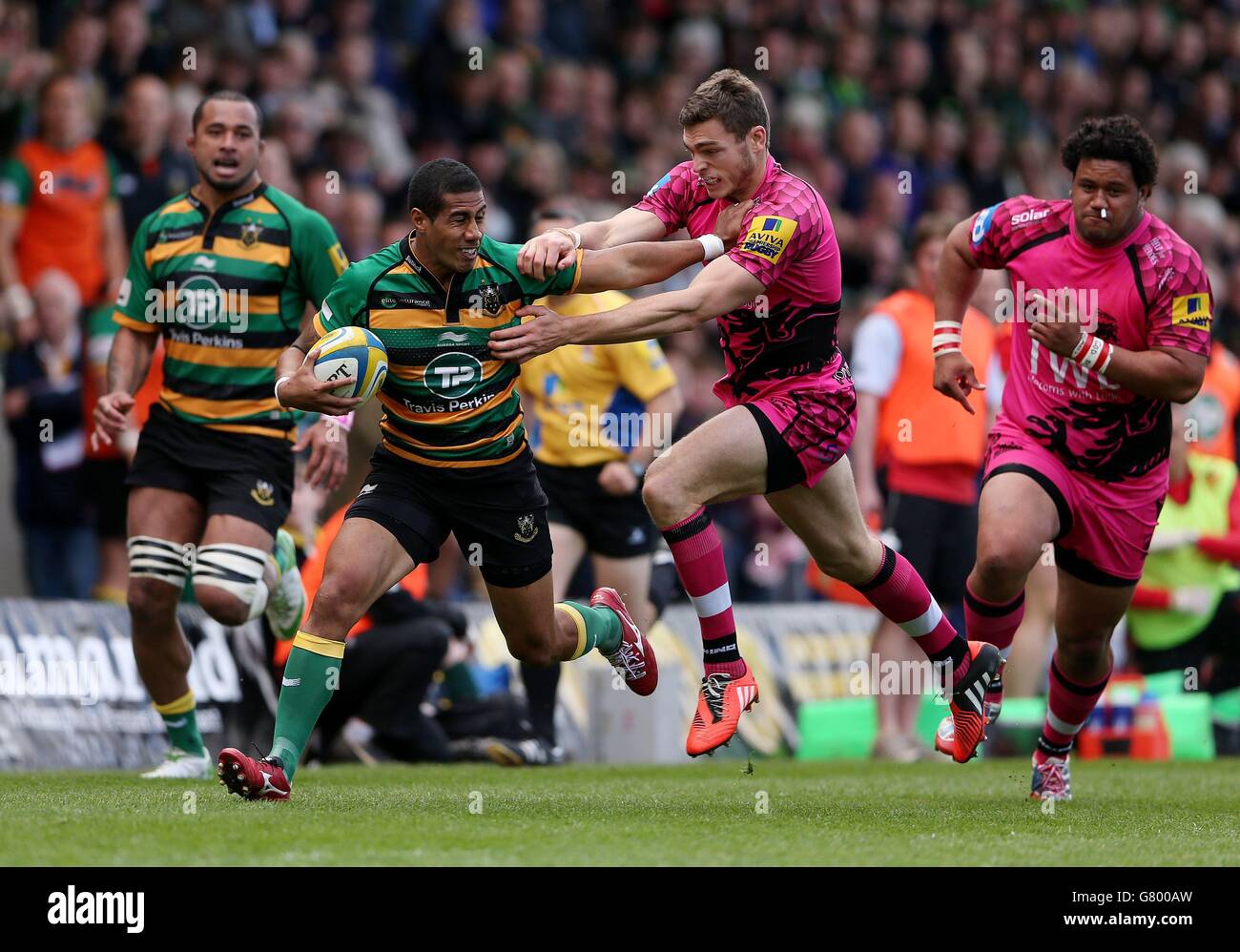 Northampton's George Pisi holds off London Welsh's Chris Elder during ...