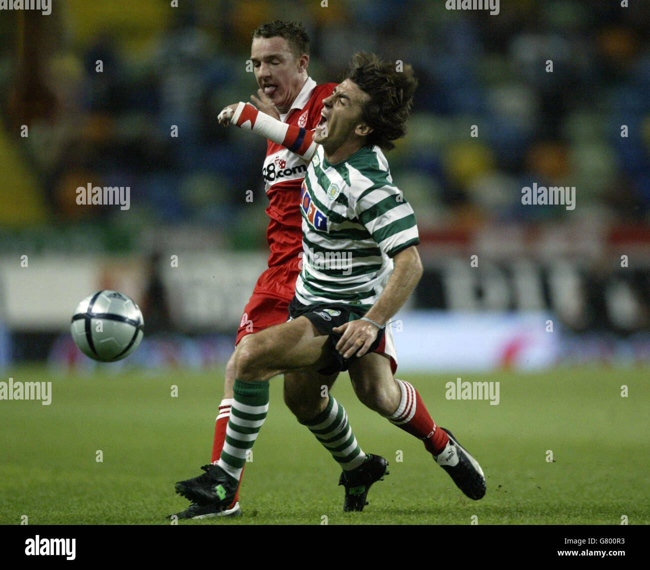 Middlesbrough's Anthony McMahon (L) wins tackle against Sporting Lisbon's Sa Pinto. Stock Photo