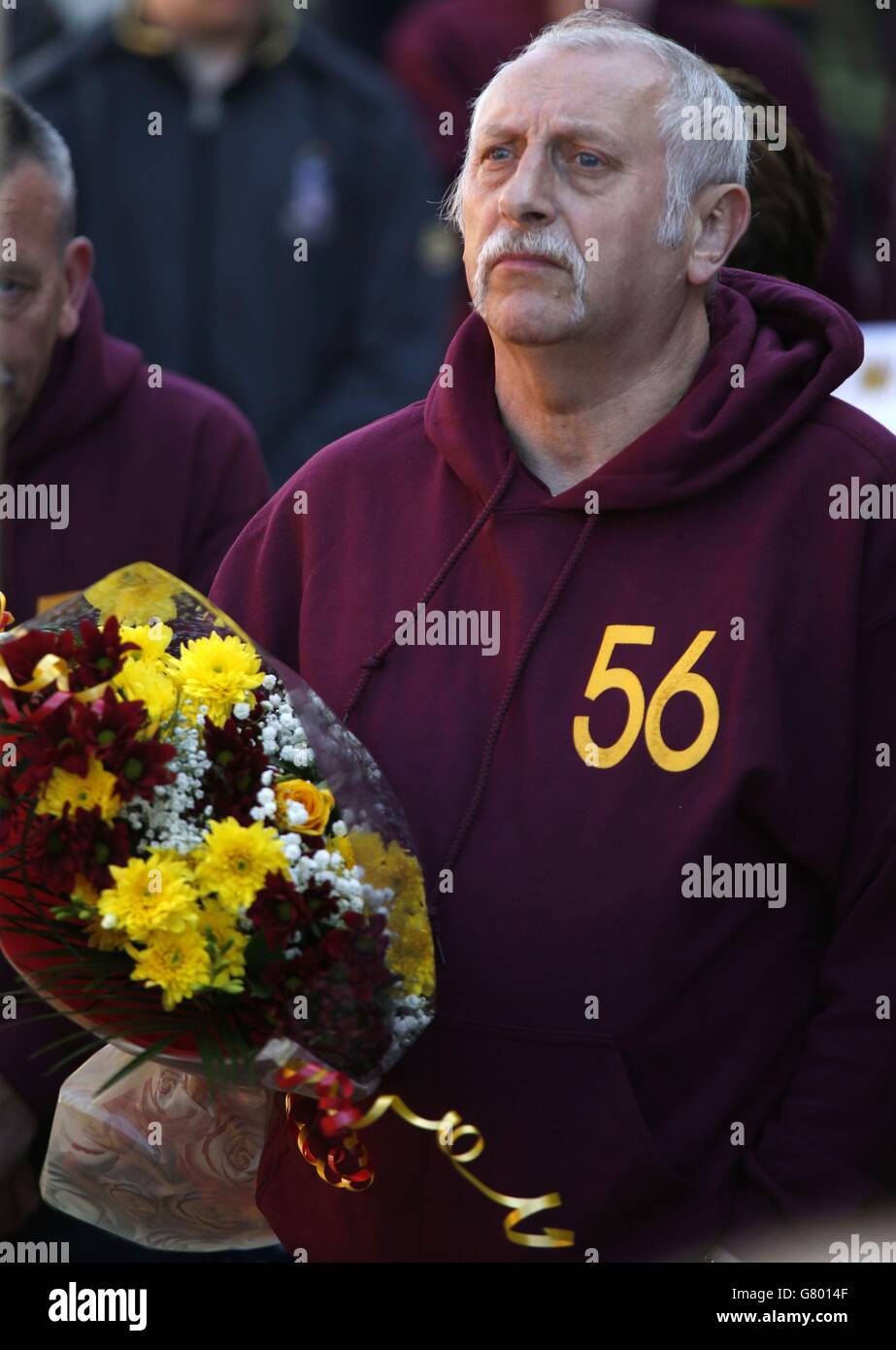 People attend a memorial service for the 30th anniversary of the deaths