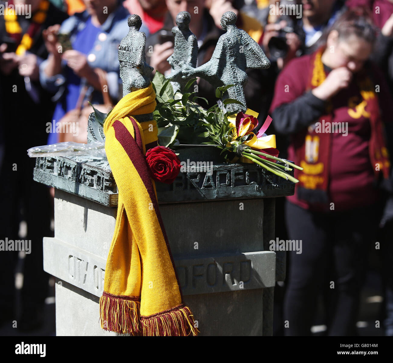 People attend a memorial service for the 30th anniversary of the deaths