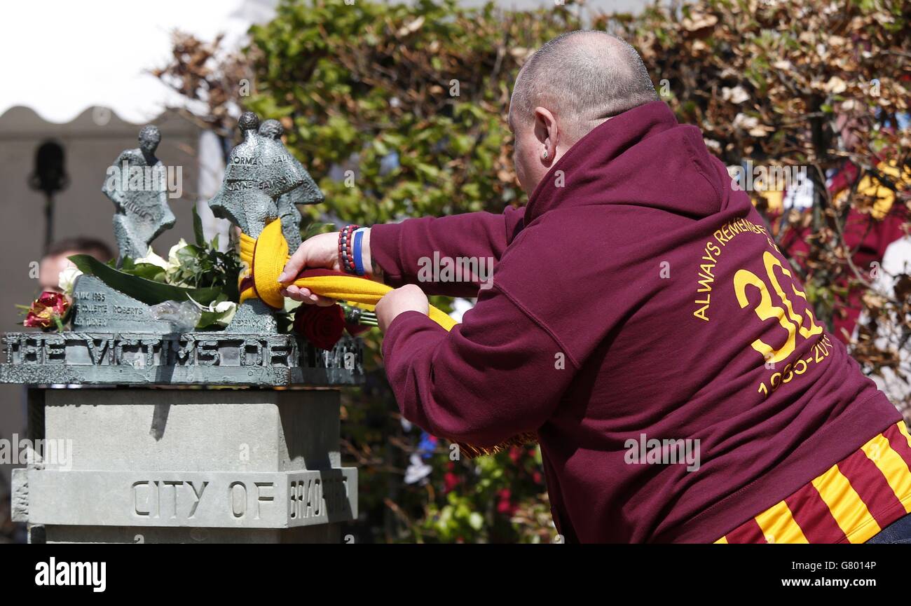 People attend a memorial service for the 30th anniversary of the deaths