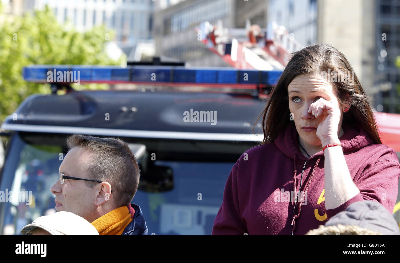 People attend a memorial service for the 30th anniversary of the deaths