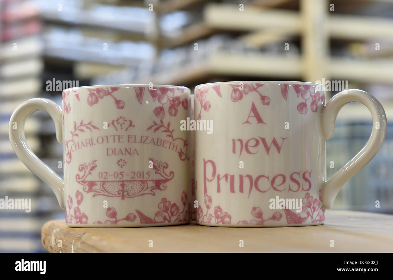 Hand decorated commemorative mugs celebrating the birth of Princess