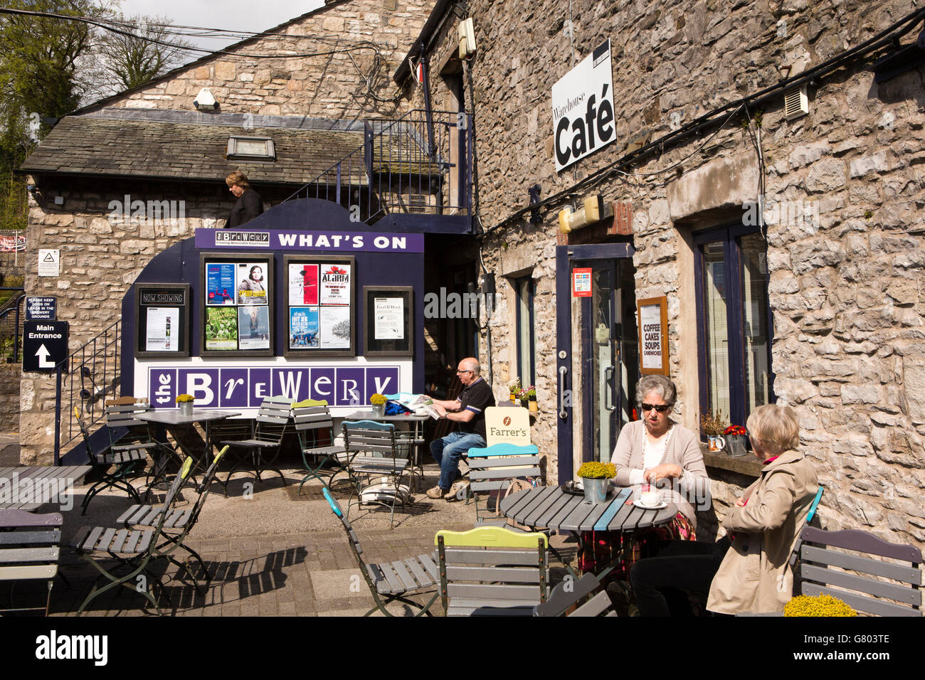 UK, Cumbria, Kendal, Highgate, Brewery Arts Centre, customers at Warehouse café sitting in sunshine Stock Photo