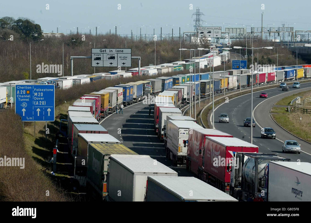 Trucks queue along the M20 near Folkestone in Kent as part of Operation Stack as travel across the Channel is disrupted due to industrial action at Calais, France. It was disclosed today that a record 2.2 million people will be heading abroad for Easter. Stock Photo