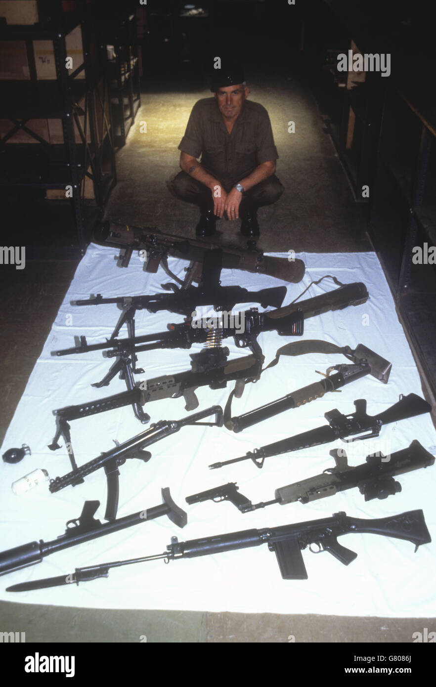 Sergeant John 'Alfie' Bass in charge of the weapons store at the Royal Marine Commando Training Centre in Lympstone, Devon. Prince Edward will soon learn to use these weapons as part of his cadet training. Stock Photo