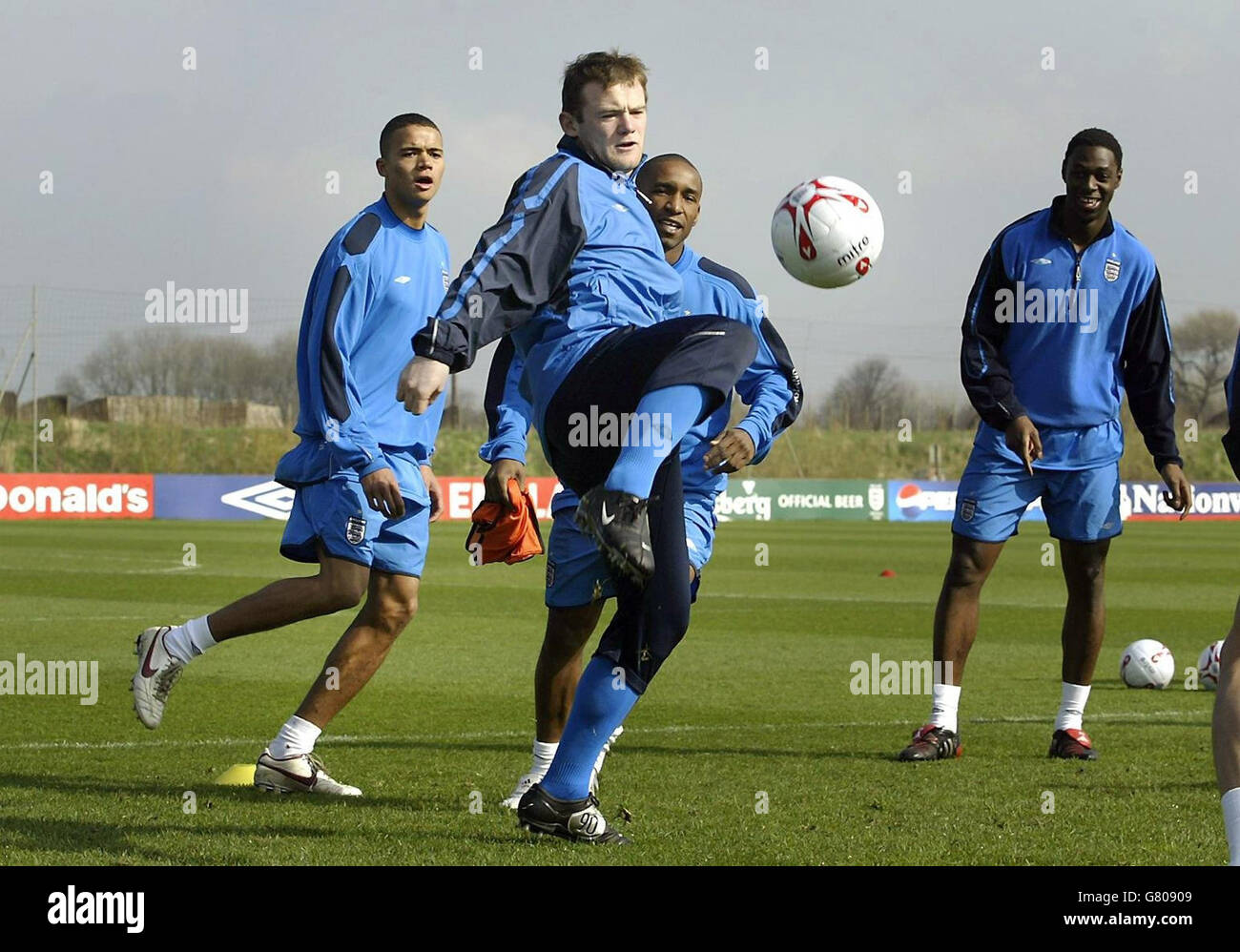 Soccer - FIFA World Cup 2006 Qualifier - Group Six - England v Northern Ireland - England Training - Carrington. England's Wayne Rooney (C) in action during a training session. Stock Photo