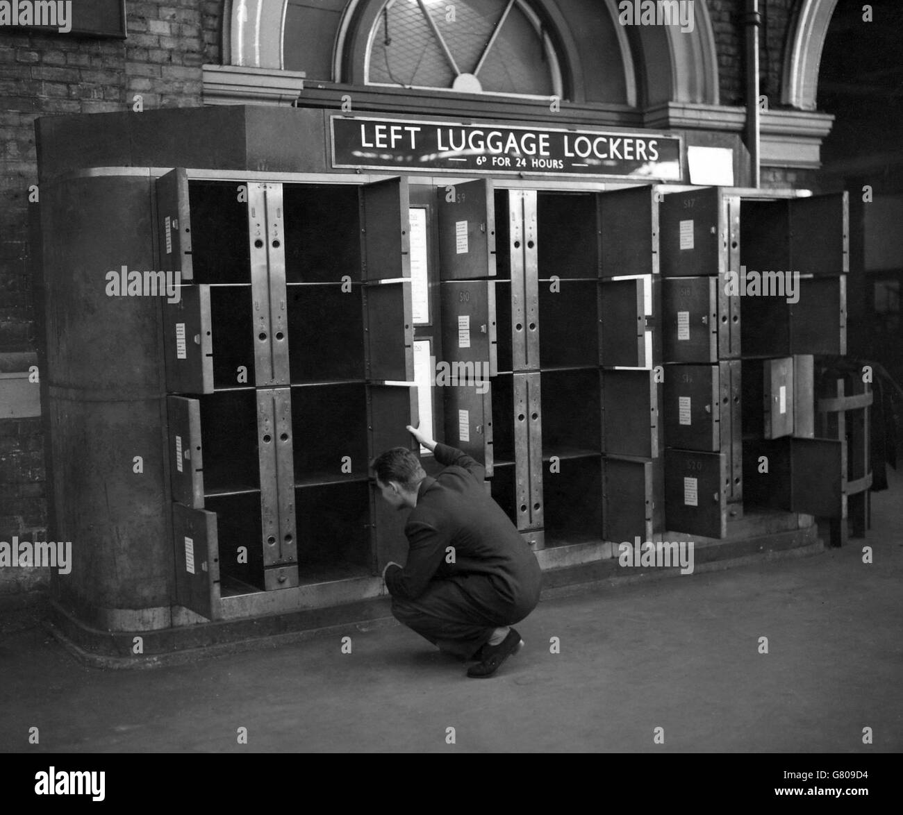 A security check is carried out at the Left Luggage Office in Victoria Station before the arrival of Russian leaders Marshal Nikolai Bulganin and Nikita Krushchev. Stock Photo