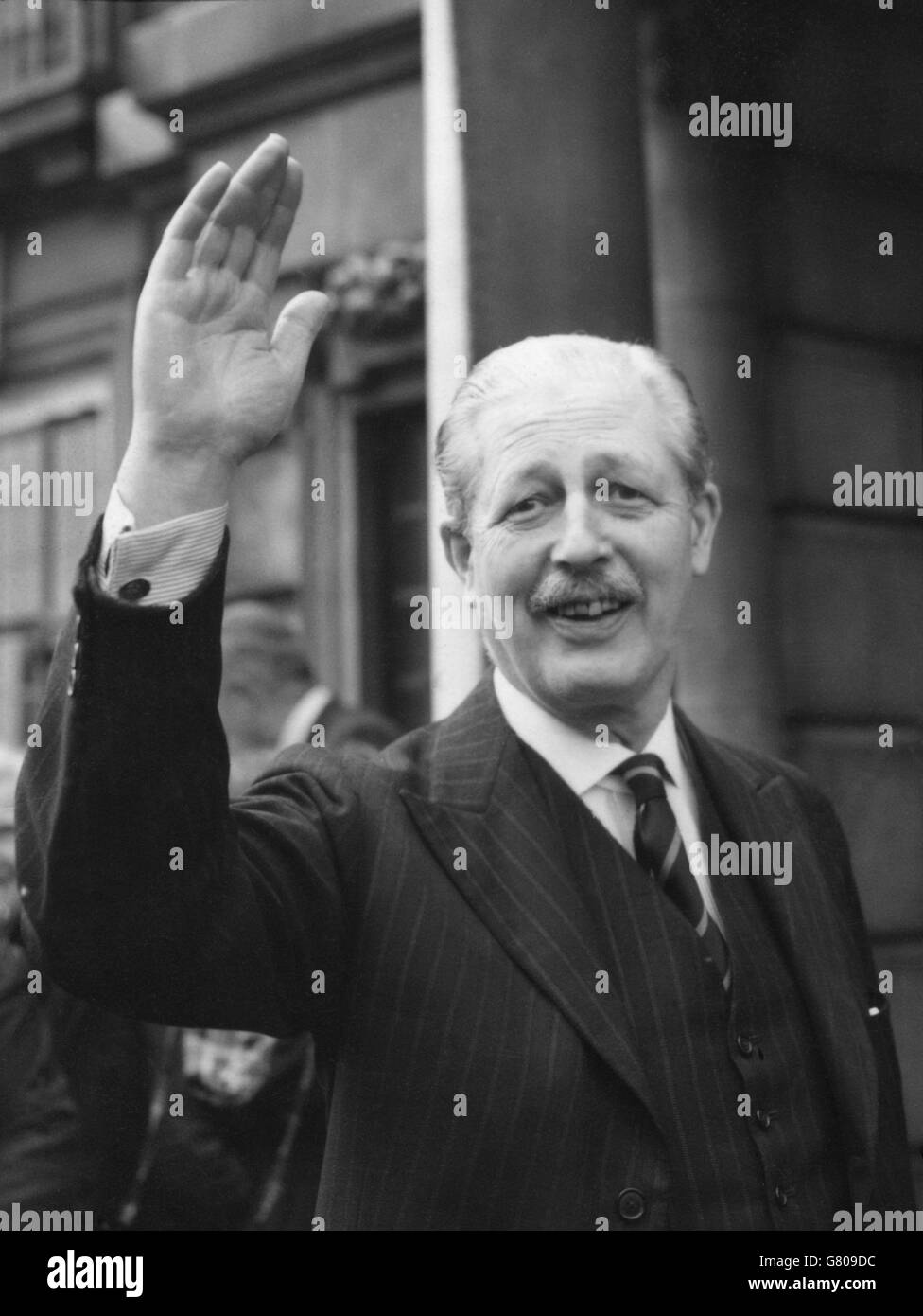 Foreign Secretary Harold Macmillan acknowledges the cheers that greet the declaration of the poll at Bromley. Macmillan had been returned with an increased majority at his constituency in Kent. Stock Photo