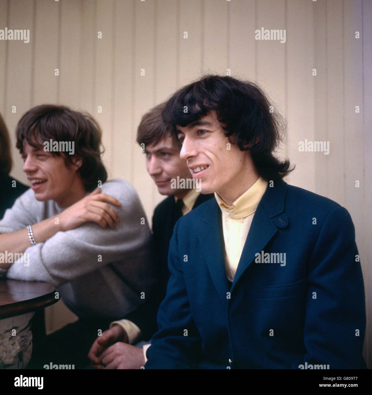 Music - The Rolling Stones. Bill Wyman from The Rolling Stones. Also pictured in the background are Charlie Watts and Mick Jagger. Stock Photo