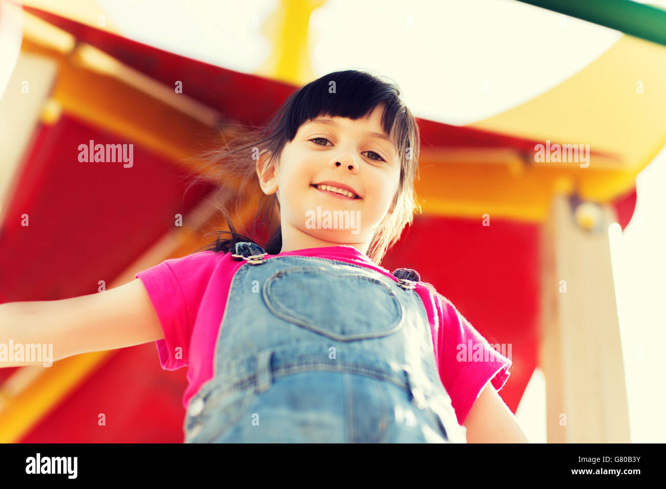 happy little girl on children playground Stock Photo - Alamy