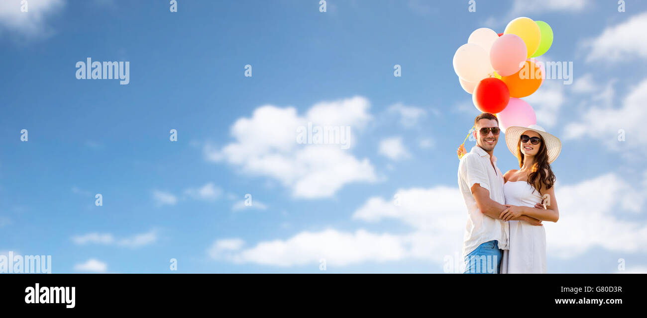smiling couple with air balloons outdoors Stock Photo - Alamy