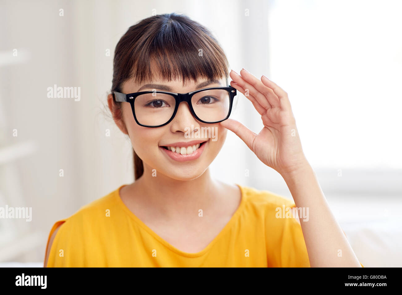 happy asian young woman in glasses at home Stock Photo - Alamy