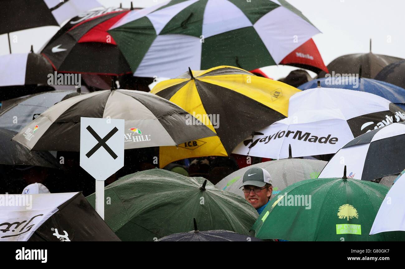 Umbrellas go up during a heavy shower during day two of the Dubai Duty Free Irish Open at Royal County Down Golf Club, Newcastle. Stock Photo