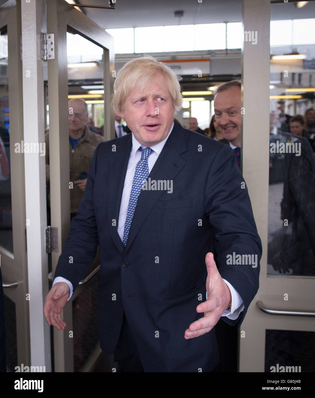 Mayor of London Boris Johnson meets staff and passengers before taking the train from Enfield Town, London, to Liverpool Street station as Transport for London takes on the responsibility of additional stations and a number of rail services out of Liverpool Street station. Stock Photo