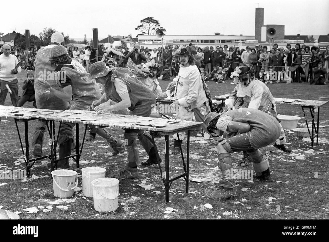 Pie throwing in earnest during the Ninth World Custard Pie Championships, held at the Coxheath Fete. The object of the championships is to land more flour and water missiles on target than their competitors. The event was won by The Hadlow Haystackers. Stock Photo