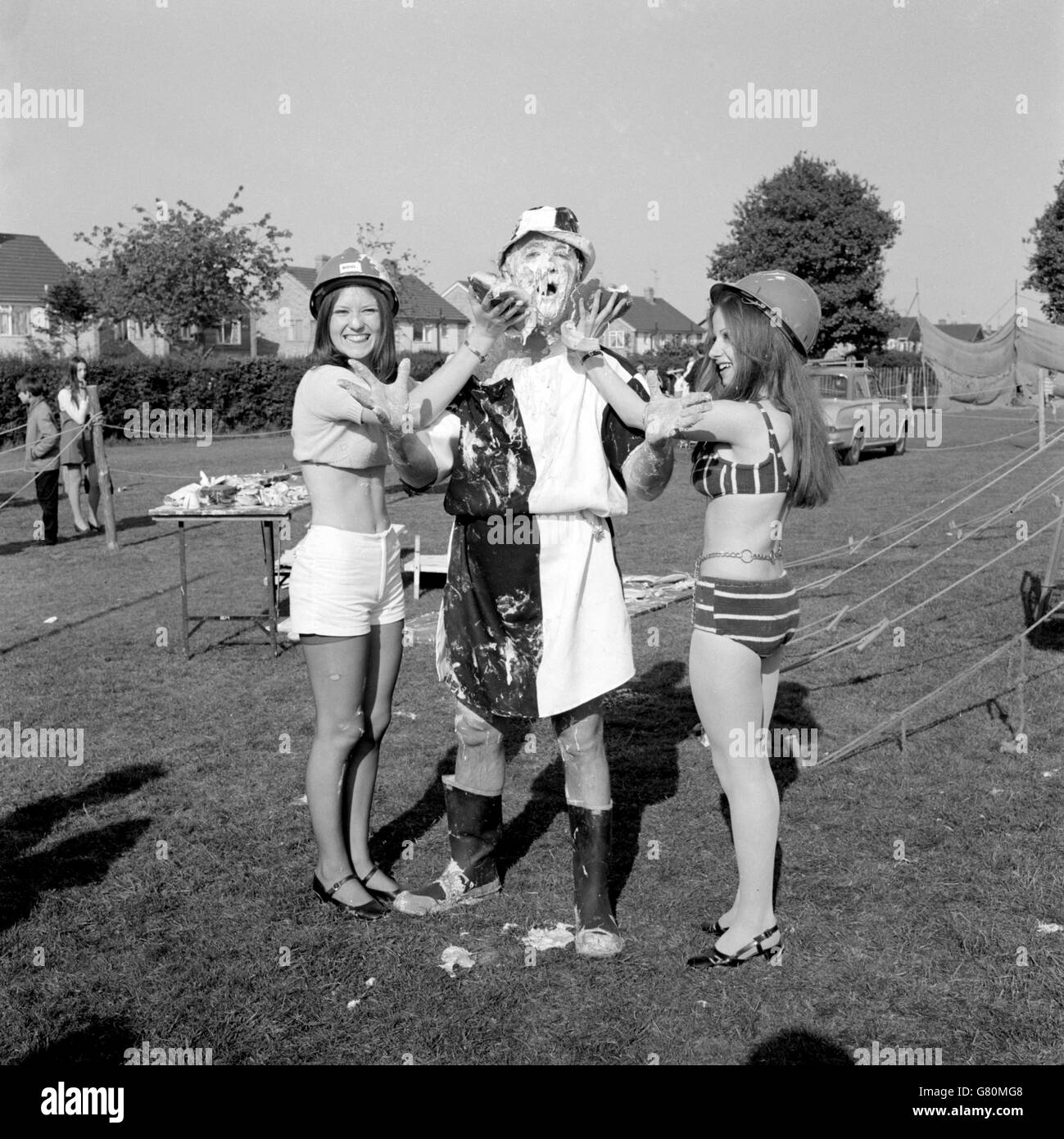 A gooey mess lands in the face of John Curl, captain of the Coxheath Chuckers, from Lorraine Fineman (r) and Sandra White, both aged 19. The occasion was the Third World Custard Pie Championships held at Coxheath, near Maidstone. Lorraine, of Maida Vale, London, and Sandra, of Feltham, Middlesex, were members of The Redheads from Heathrow Airport, who competed in the championships. John led the Chuckers in retaining their world title. Eight team, one from Canada, took part in the championships. Stock Photo