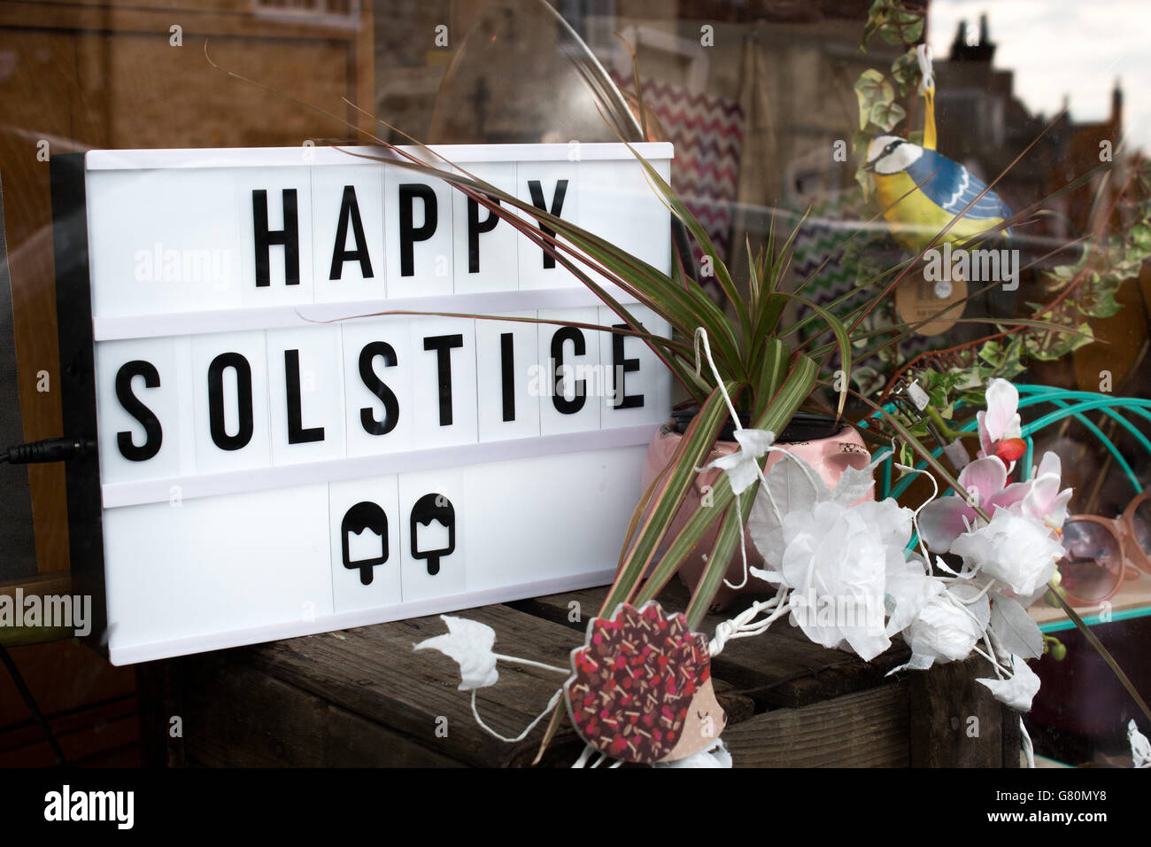 A 'happy solstice' sign in a shop window in Steep Hill, Lincoln. Stock Photo