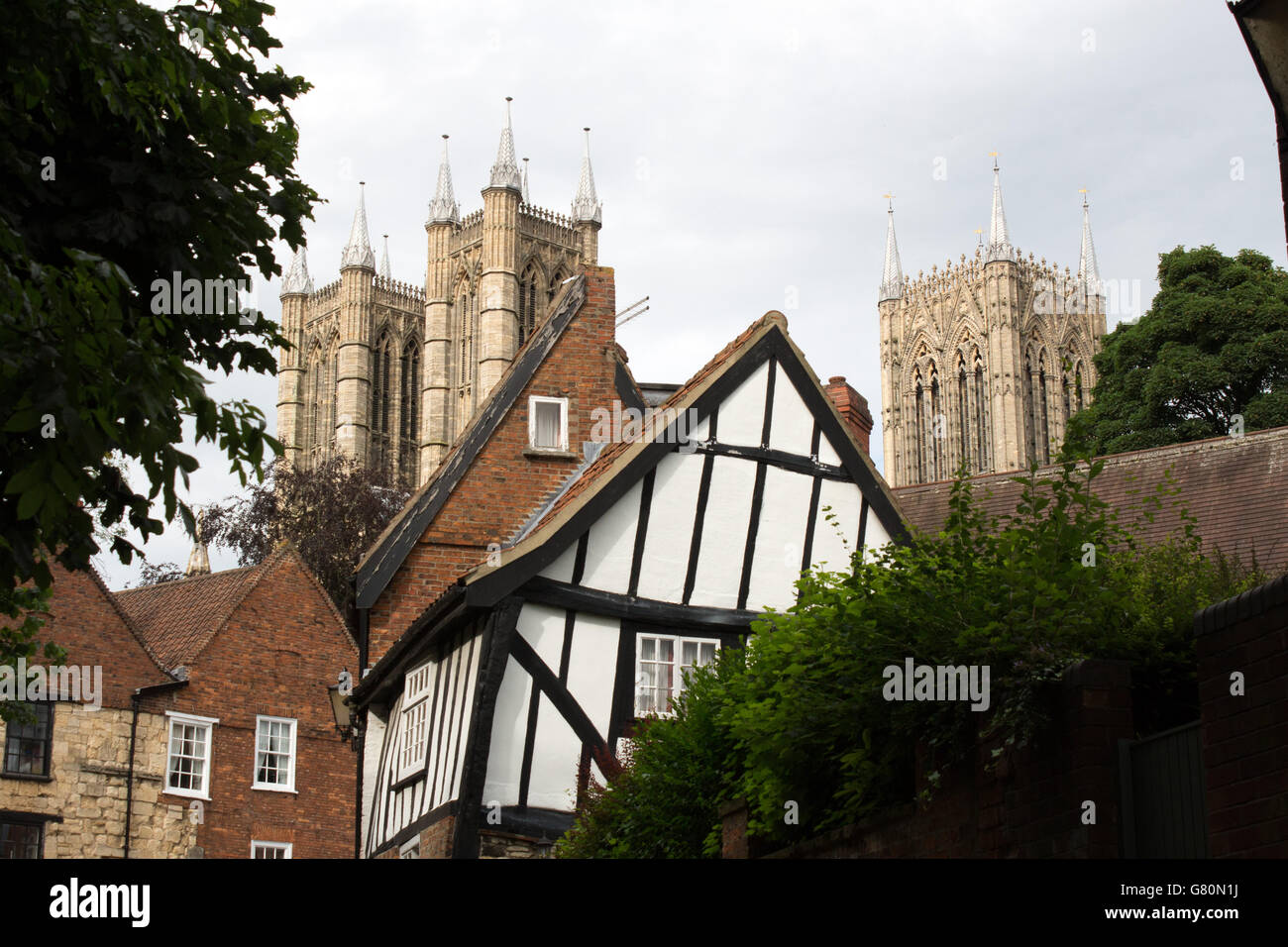 Black and White timbered houses on Michaelgate with a view to Lincoln Cathedral. Stock Photo