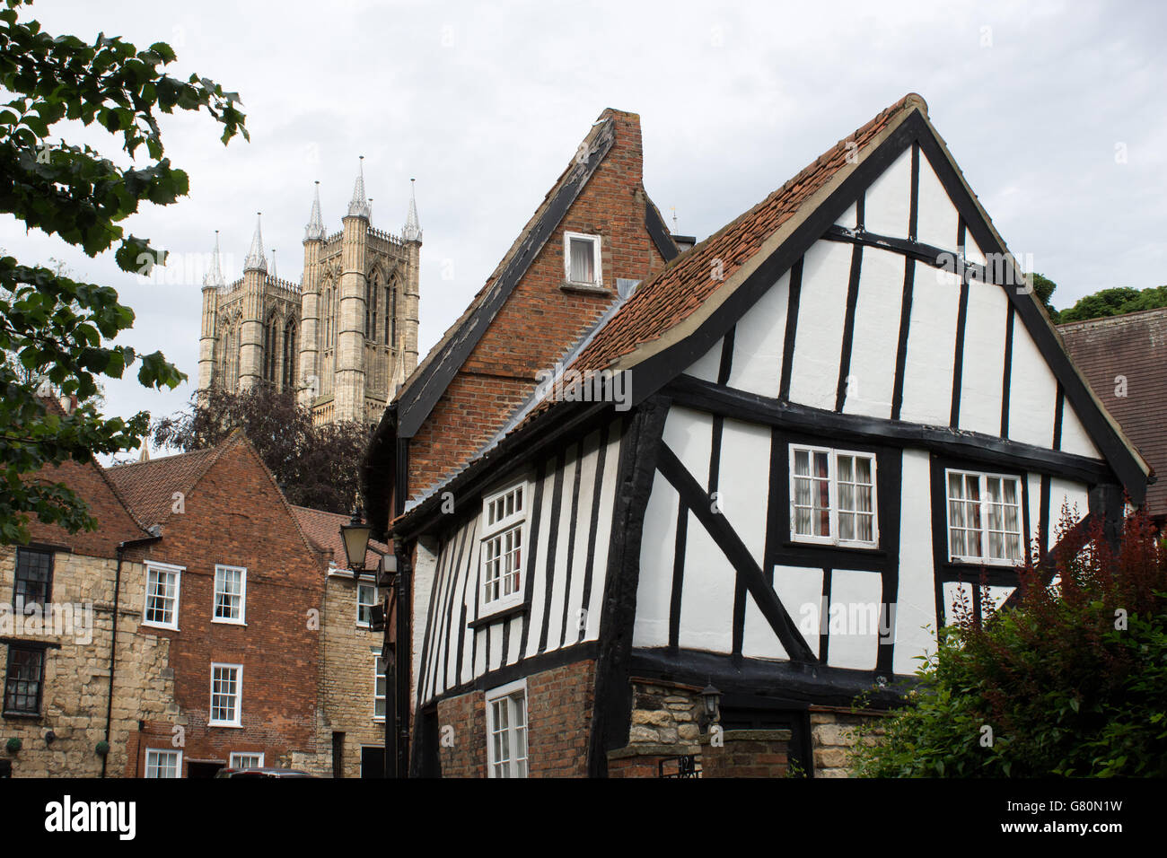 Black and White timbered houses on Michaelgate with a view to Lincoln Cathedral. Stock Photo