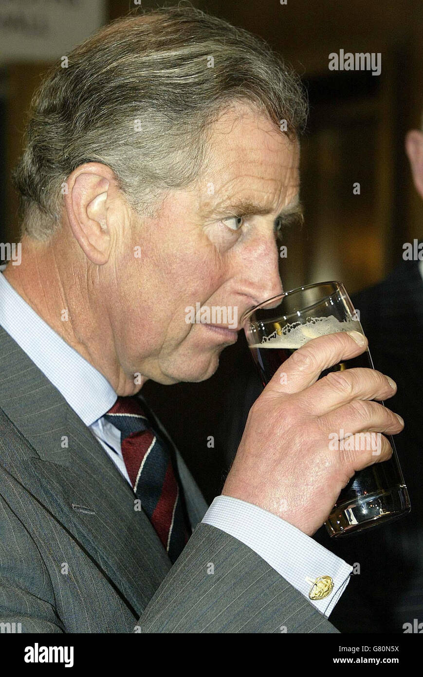 The Prince of Wales enjoys a locally brewed beer as he opened a new restaurant and shop using locally sourced produce at Booths Supermarket. Stock Photo