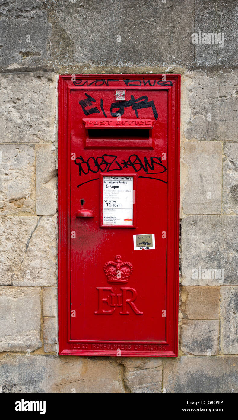 Defaced wall post box, Broad Street, Oxford, UK Stock Photo