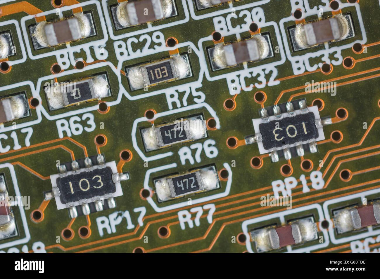 Concept - computer technology / cpu / system architecture. Socket 7 components below CPU chip. Wiring inside computer, circuit close up. Stock Photo