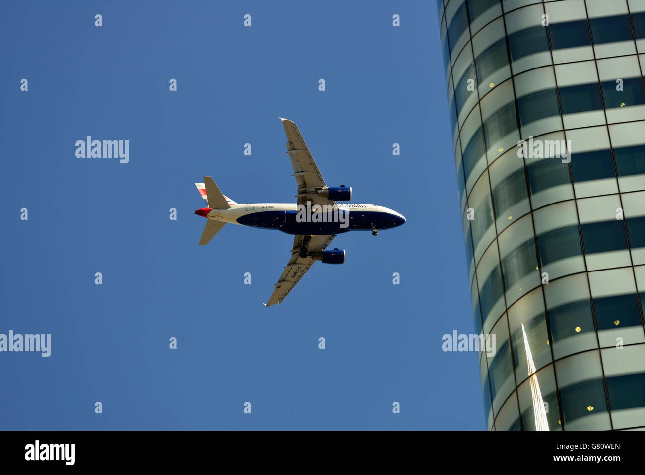 Passenger aeroplane approaching City Airport, Canary Wharf Estate, Docklands, East London, United Kingdom Stock Photo