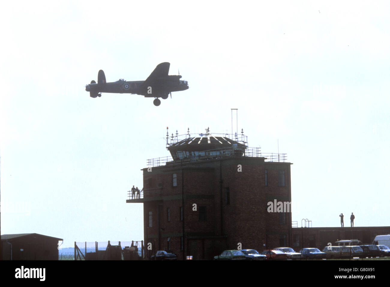 A Lancaster bomber, the type flown by the 'Dambusters' flies over the airfield at RAF Marham, Norfolk. Stock Photo
