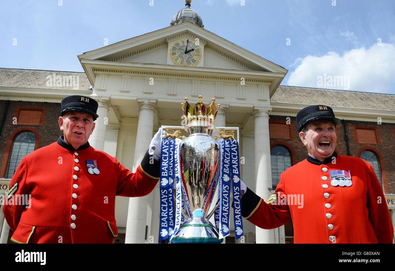 Chelsea Pensioners photograph themselves with the Premier League trophy at the Royal Hospital Chelsea in London today which was lent to them by the champions, Chelsea. PRESS ASSOCIATION Thursday May 28 2015. Photo credit should read: Stefan Rousseau/PA Wire Stock Photo