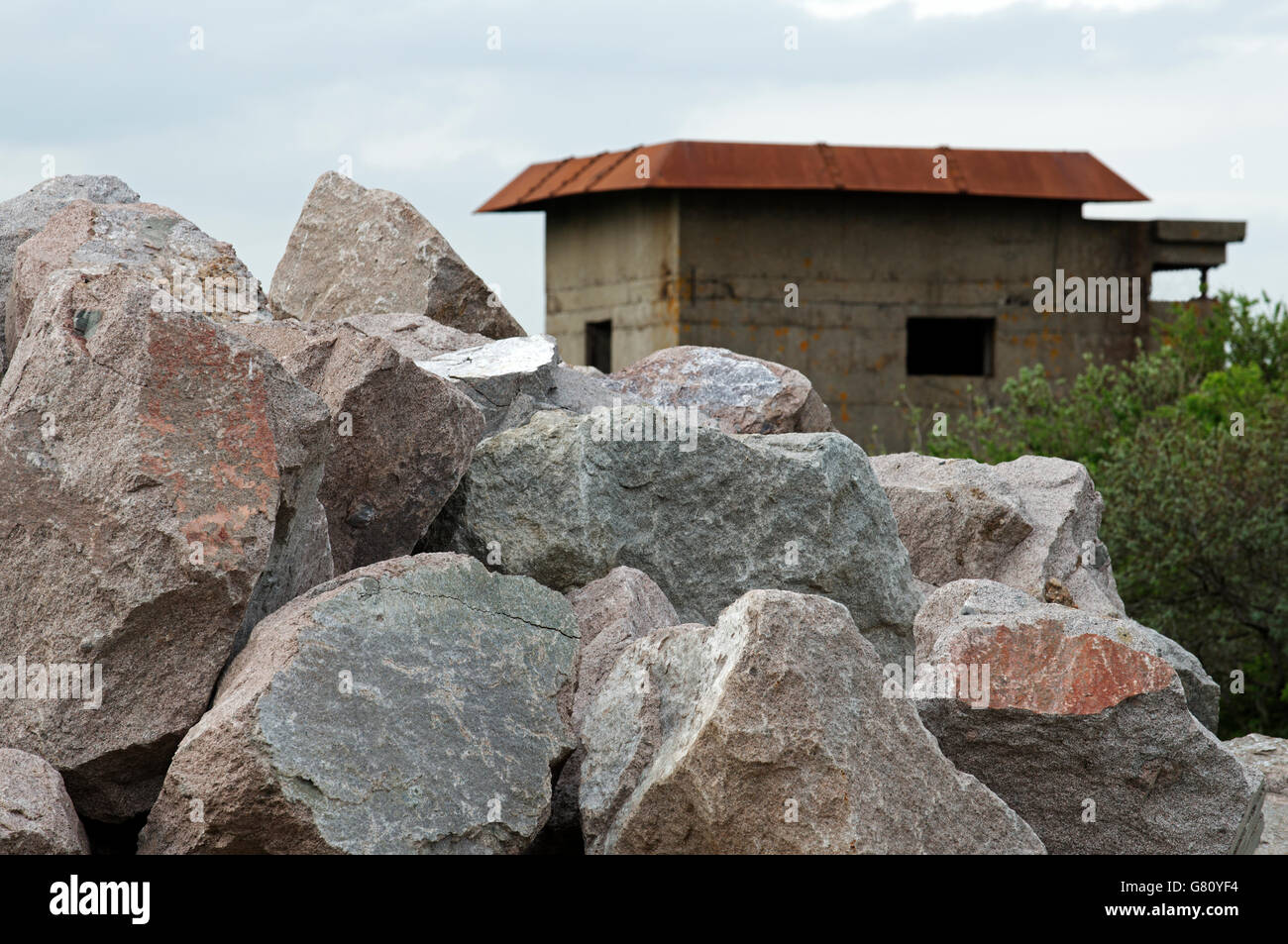 Rock armour pile for coastal defence work, East Lane, Bawdsey, Suffolk, UK. Stock Photo