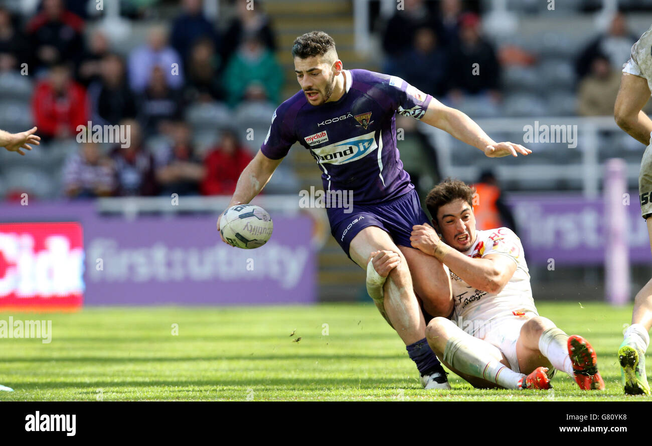 Catalan Dragons's Tony Gigot tackles and Huddersfield Giants Jake Connor during the Magic Weekend match at St James' Park, Newcastle. Stock Photo
