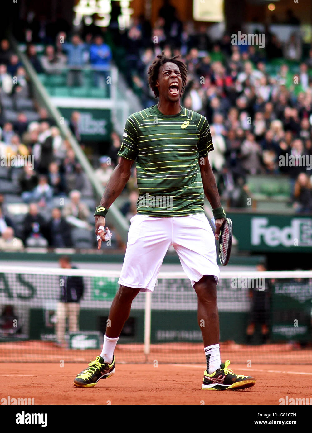 Gael Monfils shows his emotion during his round four Men's singles match  against Roger Federer on day eight of the French Open at Roland Garros on  May 31, 2015 in Paris, France
