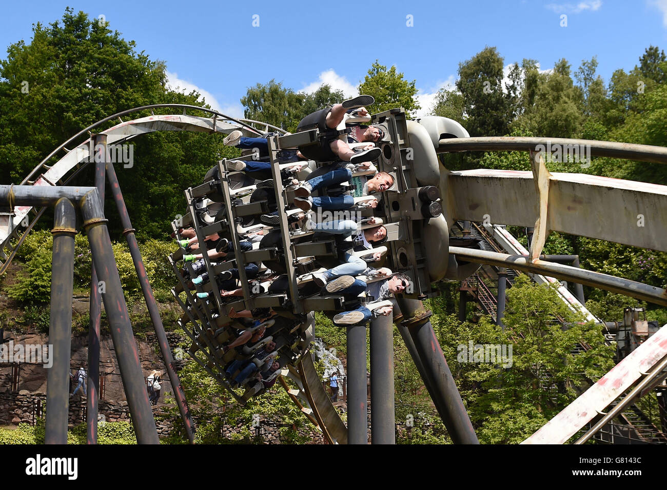 (Left to right) Matt Bennett, Erik Votjas, Lucia Pajtasova and Dan Bennett, from Cheltenham, ride Nemesis at Alton Towers in Staffordshire, as the theme park reopened after shutting its gates following a rollercoaster crash which saw four people seriously injured. Stock Photo