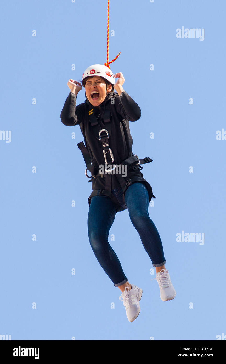 Prized Apart presenter Emma Willis reacts after jumping from a 25 metre high platform onto a trapeze outside BBC Broadcasting House, London, to mark the launch of new BBC Saturday night entertainment show Prized Apart. Stock Photo