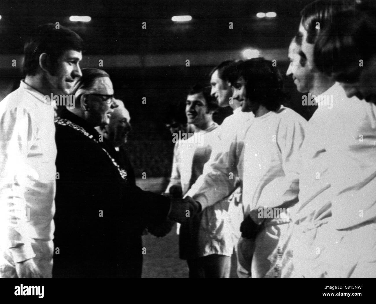 The Lord Provost of Glasgow (second l) shakes hands with Rangers/Celtic Select XI's George Best (third r) as captain John Greig (l) introduces his teammates before the match. Looking on are Sandy Jardine (fifth r), Billy McNeil (fourth r), Bobby Charlton (second r) and Terry Cooper (r) Stock Photo