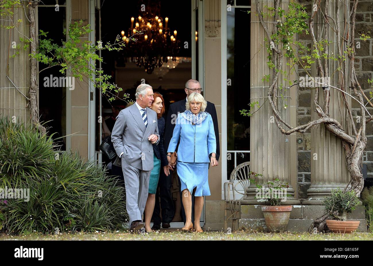The Prince of Wales and Duchess of Cornwall emerge from the house to tour the Gardens at Mount Stewart House, in Co Down on the last day of their visit to Northern Ireland. Stock Photo