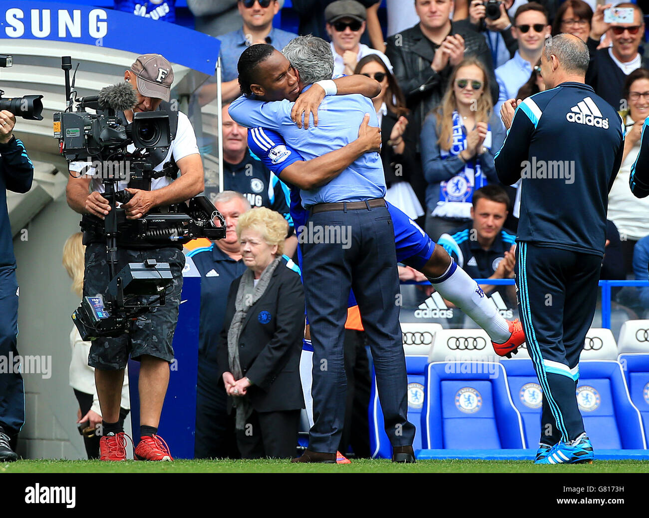 Chelsea's captain fin his final game Didier Drogba embraces manager Jose Mourinho before the Barclays Premier League match at Stamford Bridge, London. Stock Photo