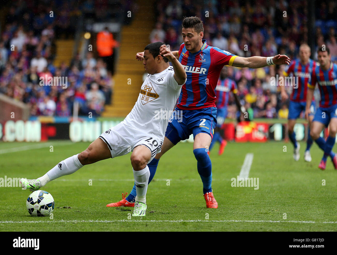 Swansea City's Jefferson Montero and Crystal Palace's Joel Ward in action during the Barclays Premier League match at Selhurst Park, London. Stock Photo