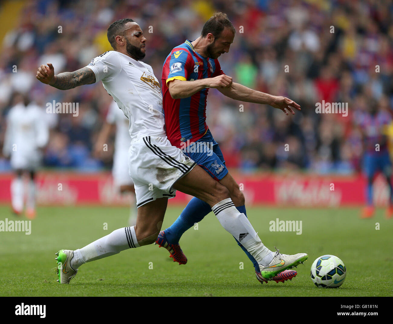 Crystal Palace's Glenn Murray and Swansea City's Kyle Bartley in action during the Barclays Premier League match at Selhurst Park, London. Stock Photo