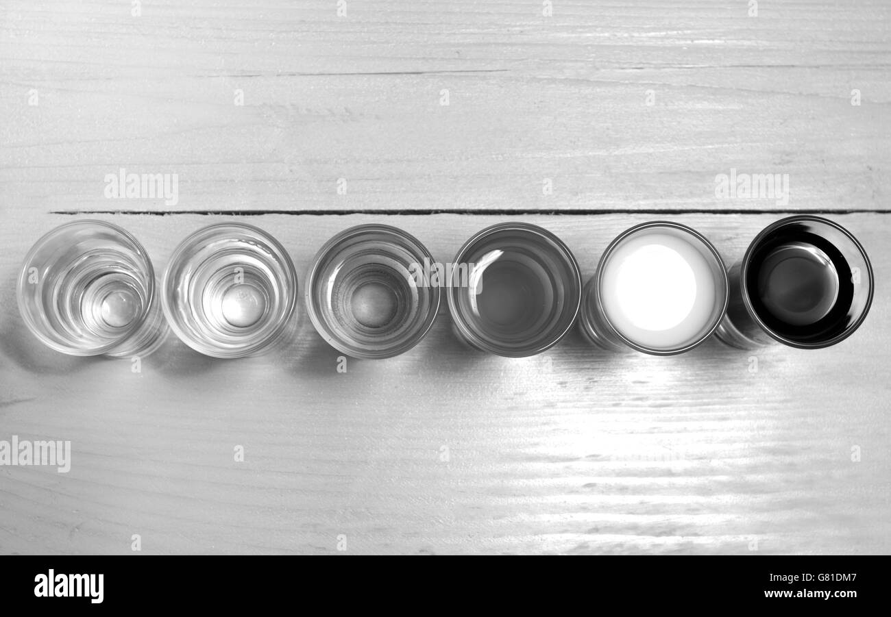 Pouring apple juice drink glass Black and White Stock Photos & Images