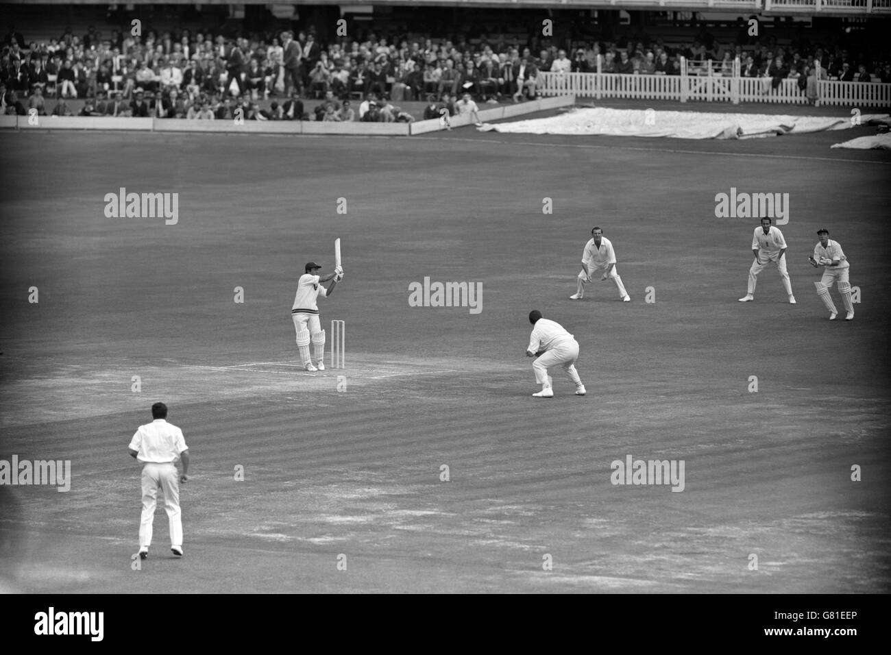 Pakistan's Hanif Mohammad (second l) hooks the first ball of the day's