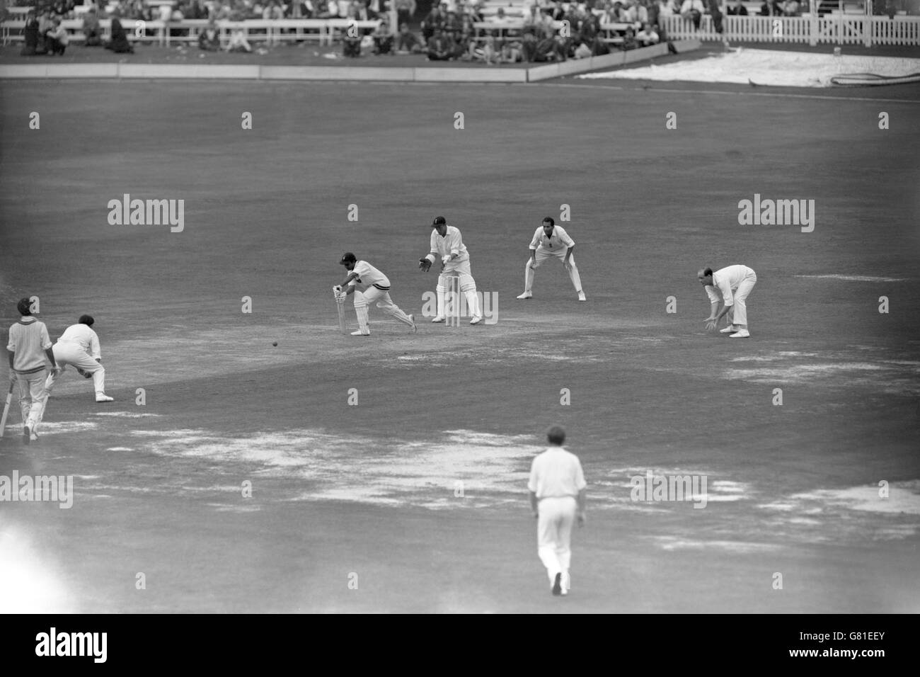 Pakistan's Hanif Mohammad (third l) plays a forward defensive, watched by England's John Murray (third r), Basil D'Oliveira (second r) and Brian Close (r) Stock Photo