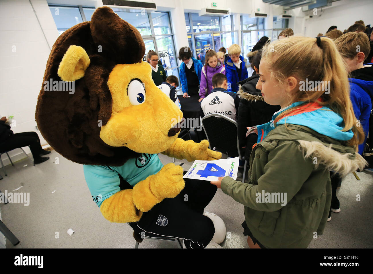 Surrey mascot Caesar the Lion signs autographs on Schools Day at the Kia Oval Stock Photo