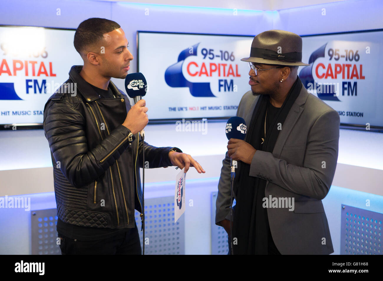 Capital FM presenter Marvin Humes (L) and music artist Ne-Yo during an interview at Capital FM Summertime Ball Radio studio, Wembley Stadium, London.. Daniel Leal-Olivas/PA Showbiz Stock Photo