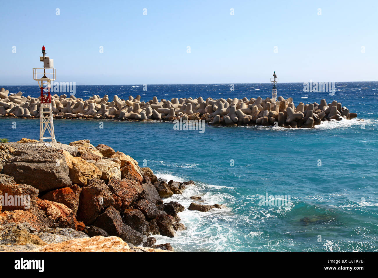A remote and rocky harbour mouth in southern Crete Stock Photo