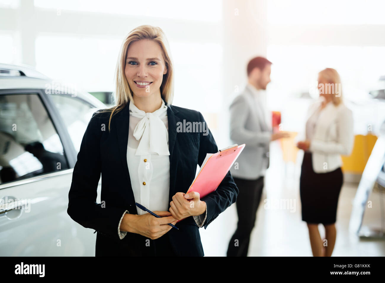 Professional salesperson working in car dealership Stock Photo Alamy