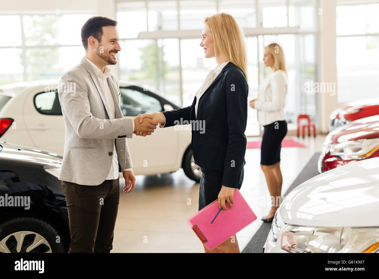 Professional salesperson working in car dealership Stock Photo Alamy